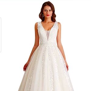 Never Worn! - White Princess Wedding Dress. 2 sizes available, 12 & 16 -